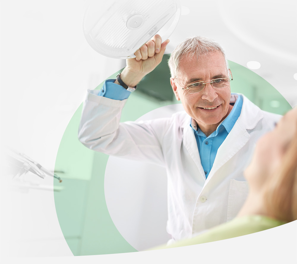 Dentist helping patient